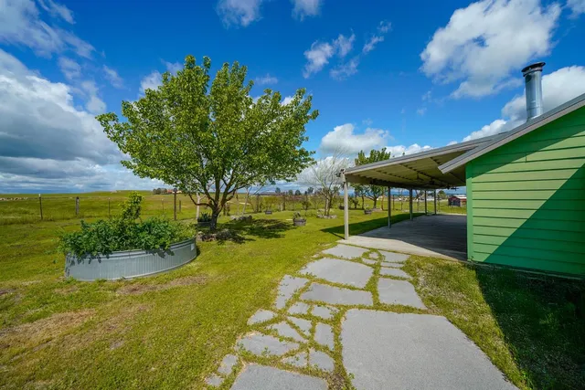 a view of a swimming pool with a patio