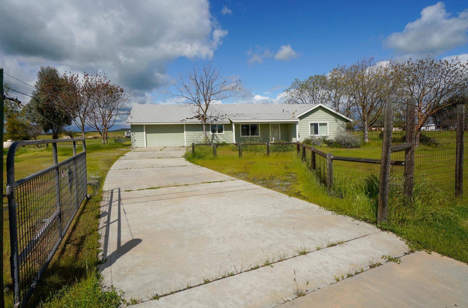 37491 Verde Avenue Madera, CA 93636 - Photo 35 of 66 a view of a swimming pool with a patio