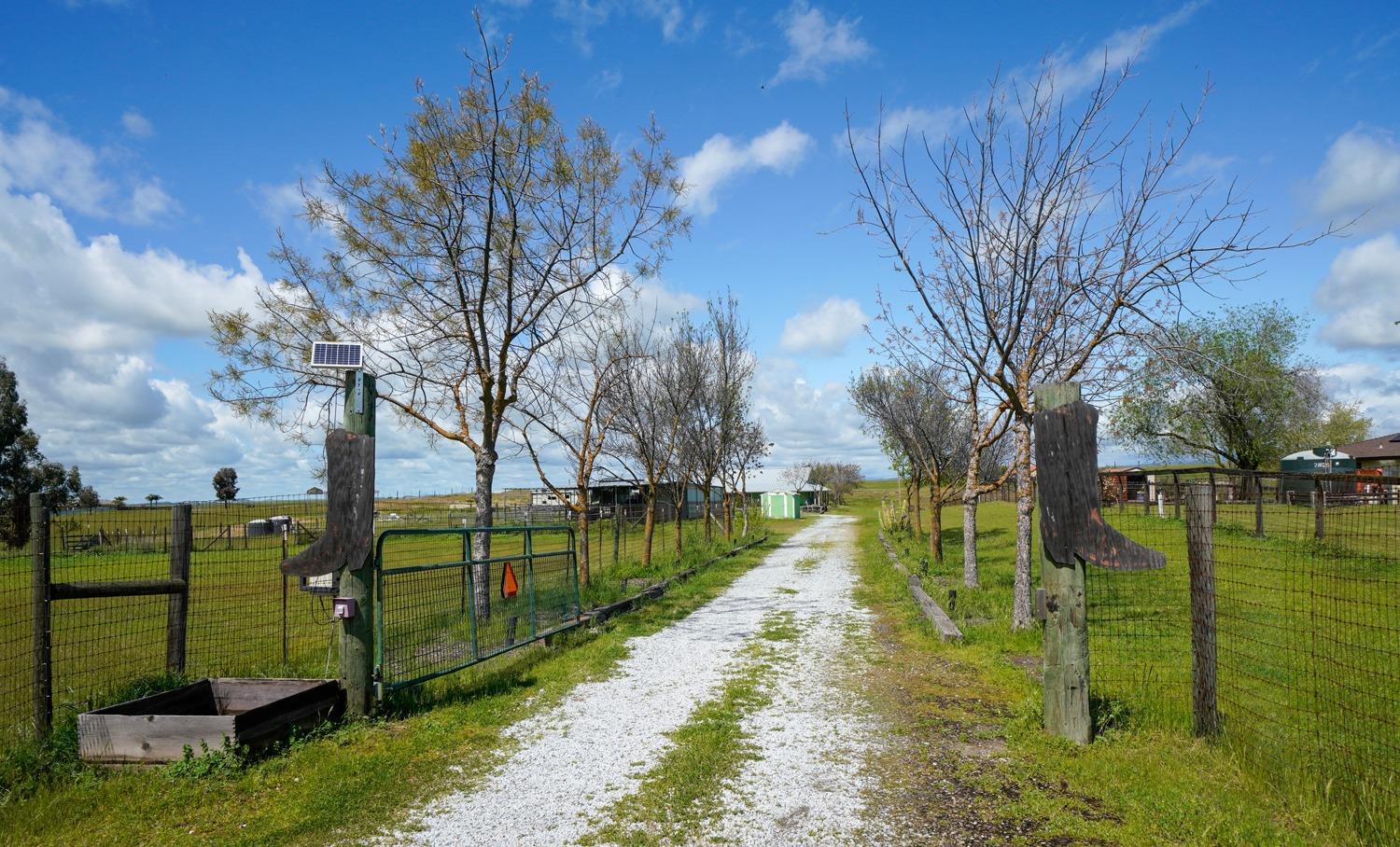 37491 Verde Avenue Madera, CA 93636 - Photo 48 of 66 a view of a lake with a house in the background
