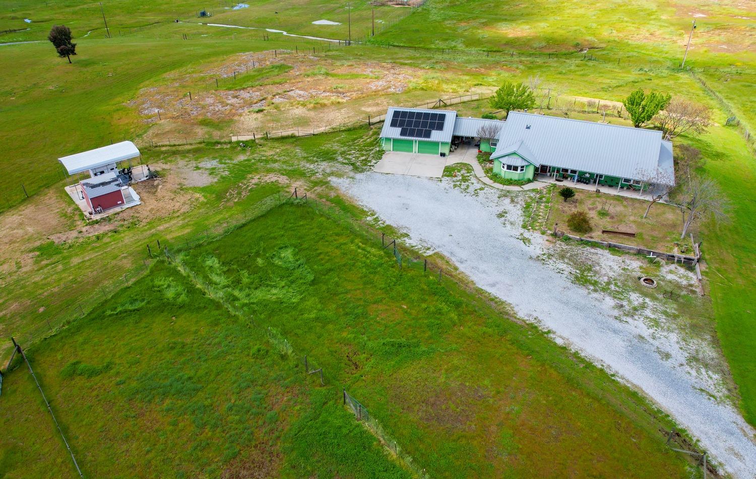 37491 Verde Avenue Madera, CA 93636 - Photo 51 of 66 an aerial view of a house with a yard