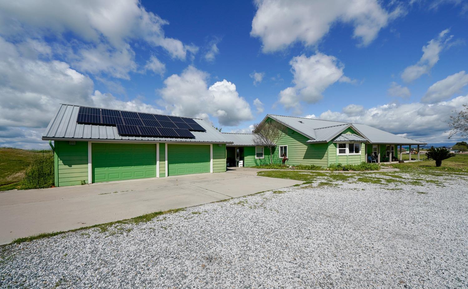 37491 Verde Avenue Madera, CA 93636 - Photo 56 of 66 a view of a house with a yard and large trees