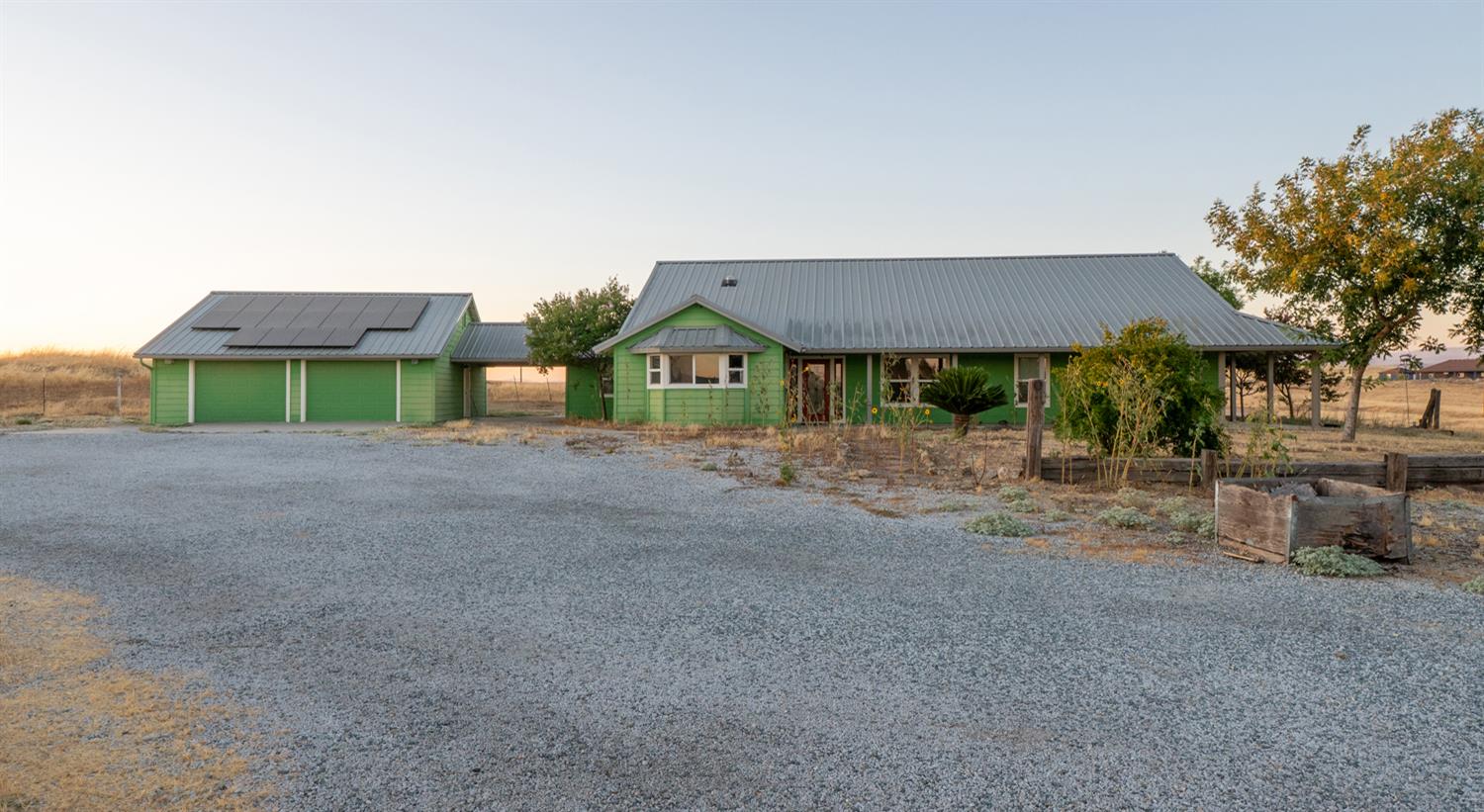 37491 Verde Avenue Madera, CA 93636 - Photo 59 of 66 a front view of a house with a yard