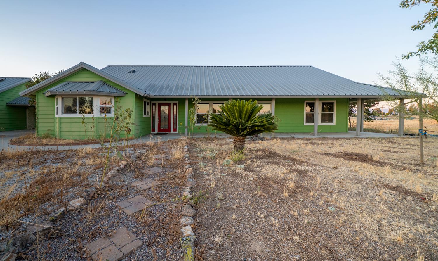 37491 Verde Avenue Madera, CA 93636 - Photo 61 of 66 a front view of a house with a yard
