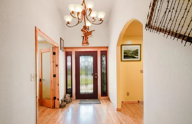 a kitchen with stainless steel appliances white cabinets a stove a sink and a refrigerator