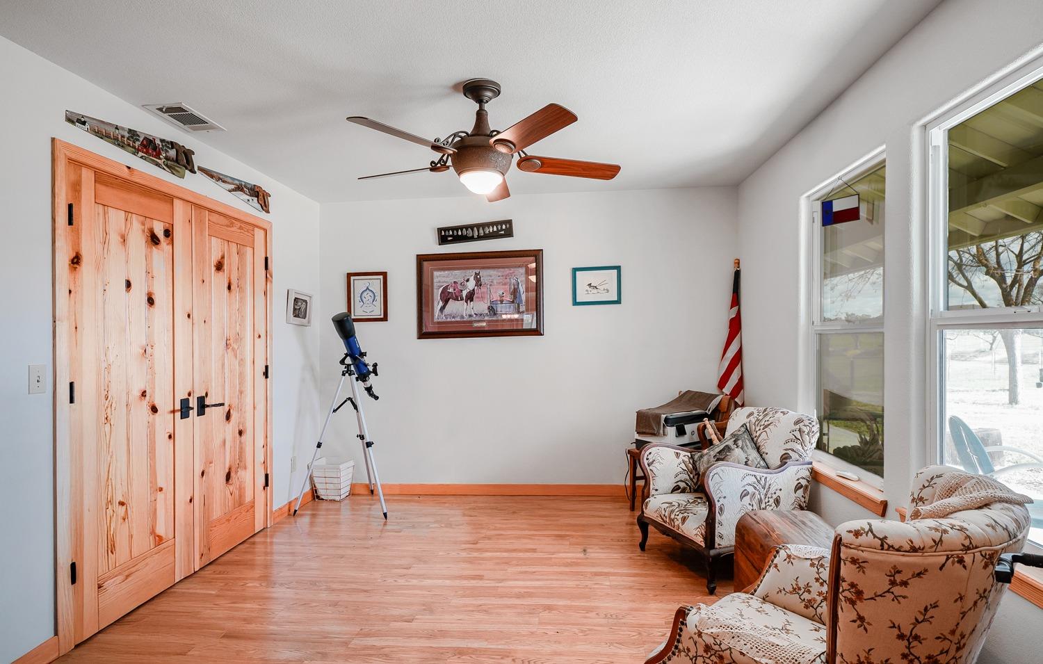 37491 Verde Avenue Madera, CA 93636 - Photo 8 of 66 a view of a workspace with wooden floor and a window