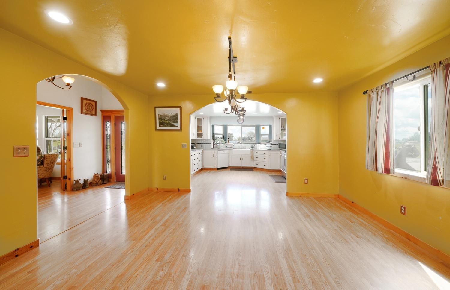 37491 Verde Avenue Madera, CA 93636 - Photo 10 of 66 a view of a house a dinning room and wooden floor