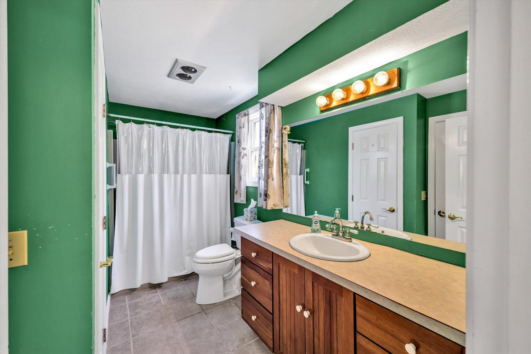 171 Currier Road East Falmouth, MA 02536 - Photo 18 of 47 a spacious bathroom with a double vanity sink mirror and toilet