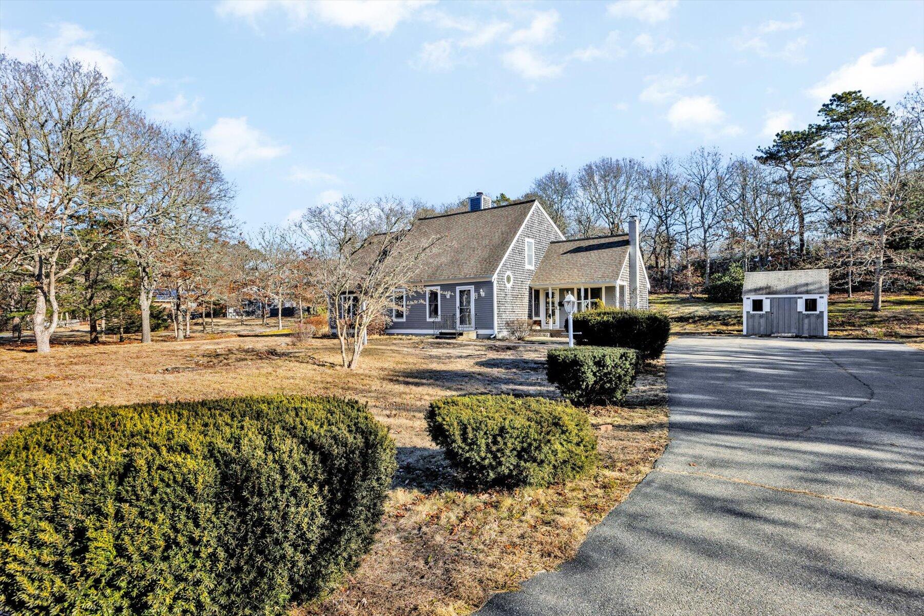 171 Currier Road East Falmouth, MA 02536 - Photo 2 of 47 a view of house with outdoor space and sitting area