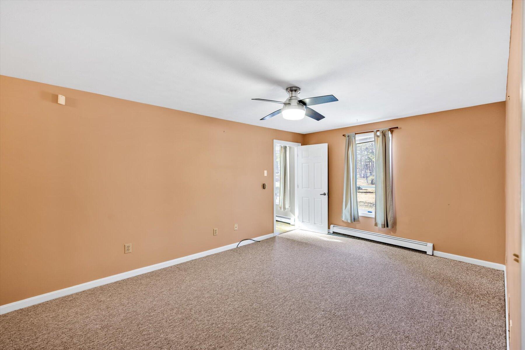 171 Currier Road East Falmouth, MA 02536 - Photo 21 of 47 a view of an empty room with a window