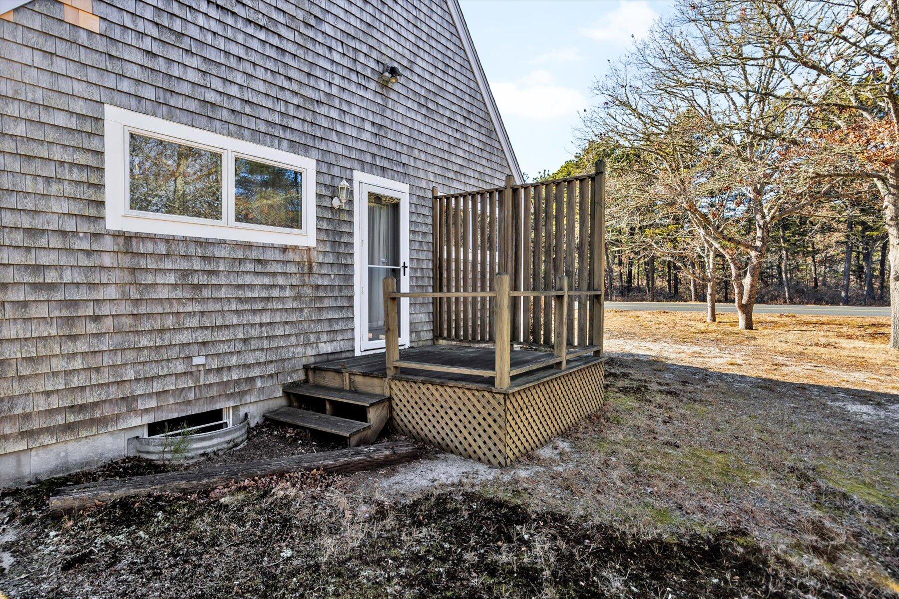 171 Currier Road East Falmouth, MA 02536 - Photo 33 of 47 a view of a house with backyard and trees