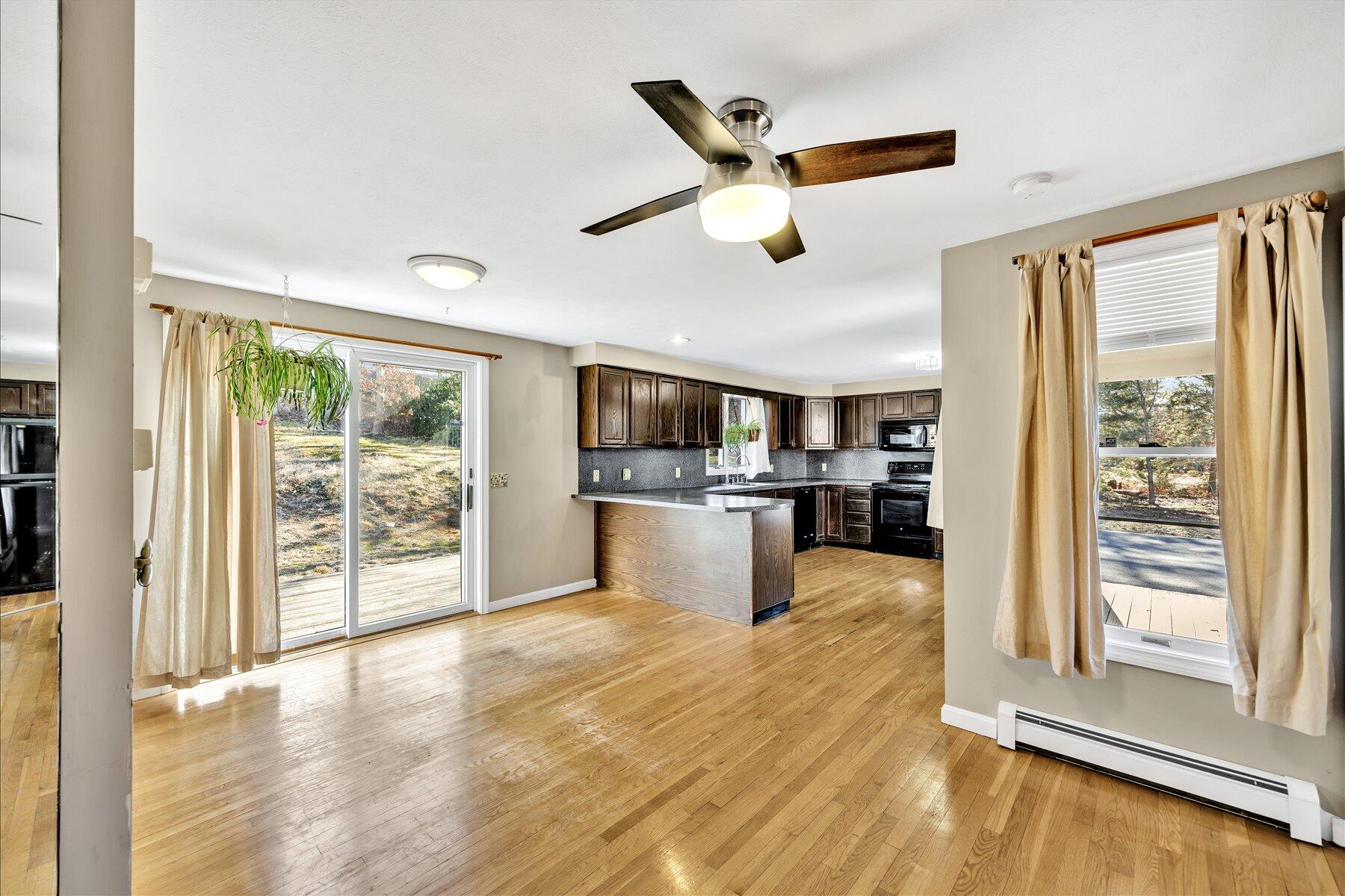 171 Currier Road East Falmouth, MA 02536 - Photo 10 of 47 a view of a kitchen with furniture wooden floor and window