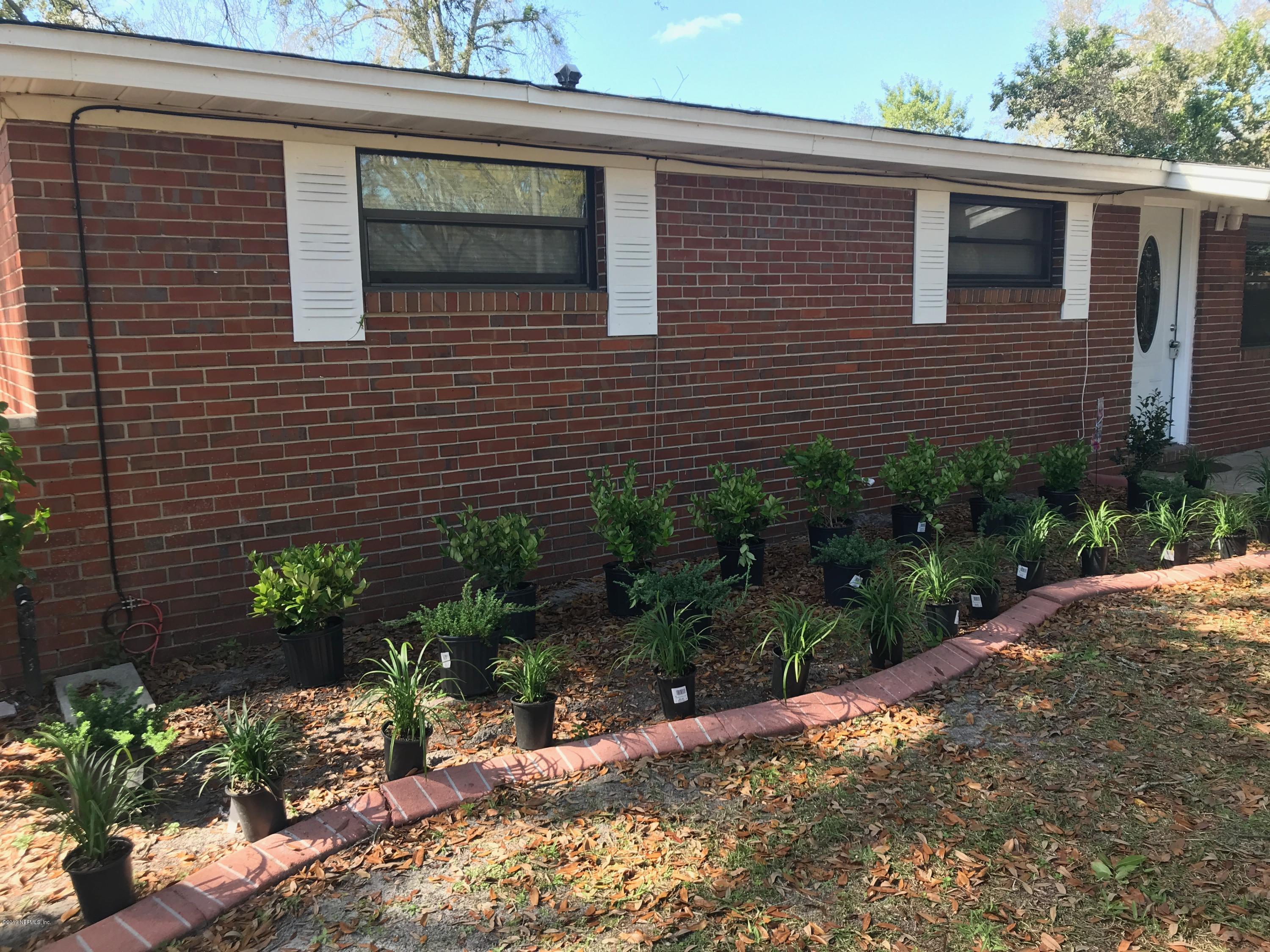 5626 Ricker Road Jacksonville, FL 32244 - Photo 4 of 25 a view of a house with a yard