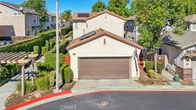 a view of a house with a yard and garage