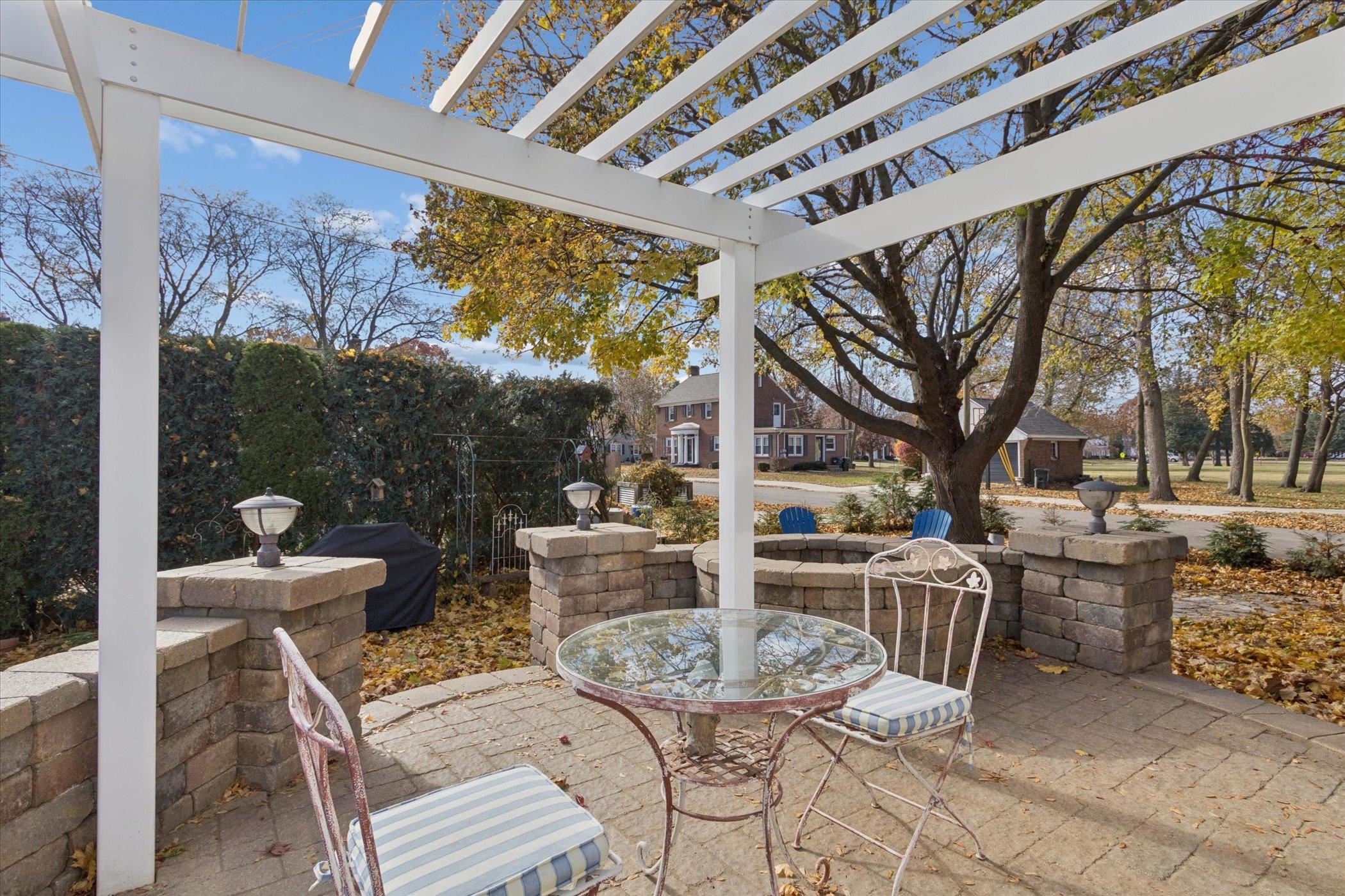 1408 Ave D Sterling, IL 61081 - Photo 11 of 55 a view of a patio with a dining table and chairs with wooden floor and fence