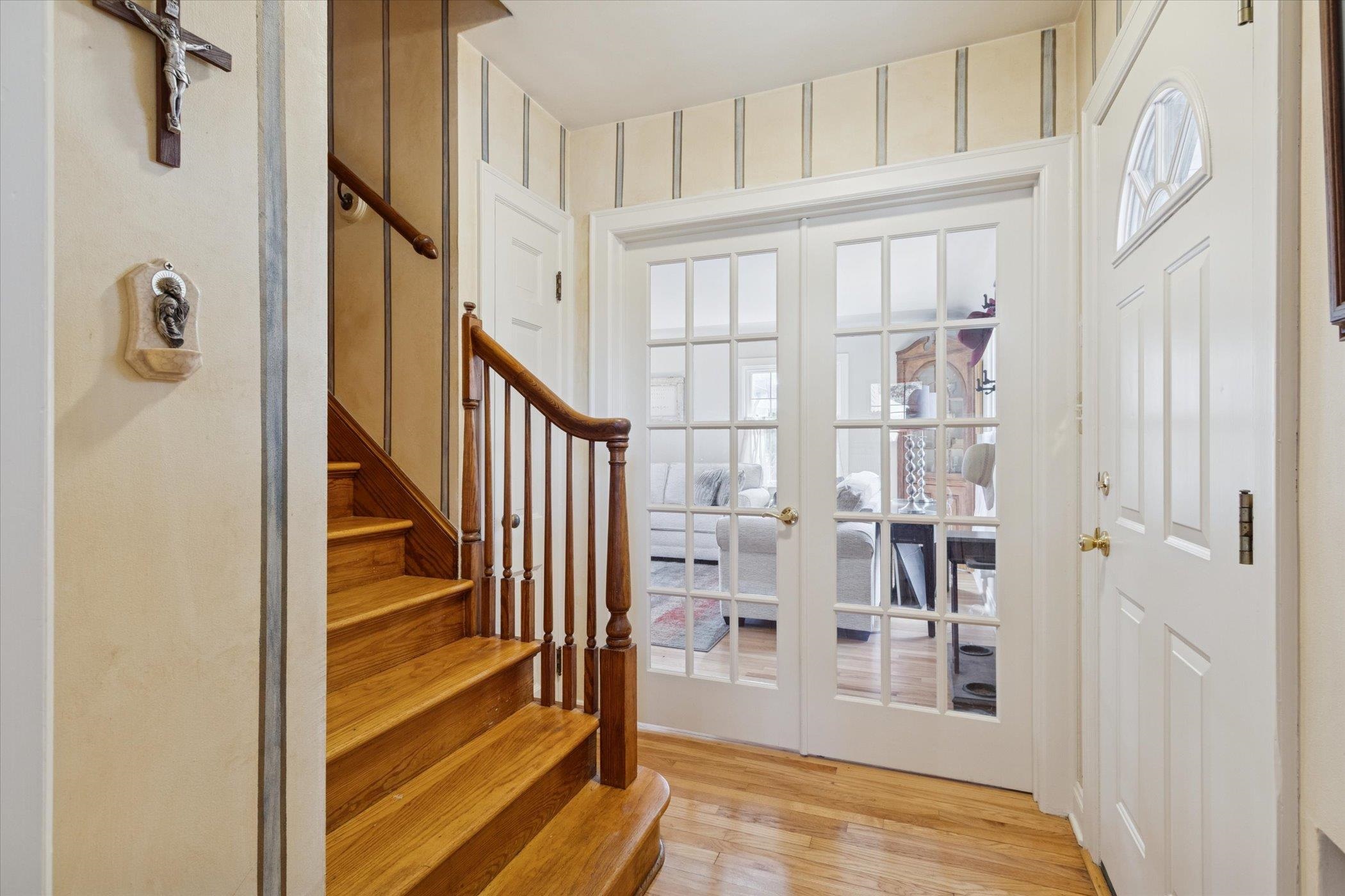 1408 Ave D Sterling, IL 61081 - Photo 24 of 56 a view of a livingroom with wooden floor and staircase