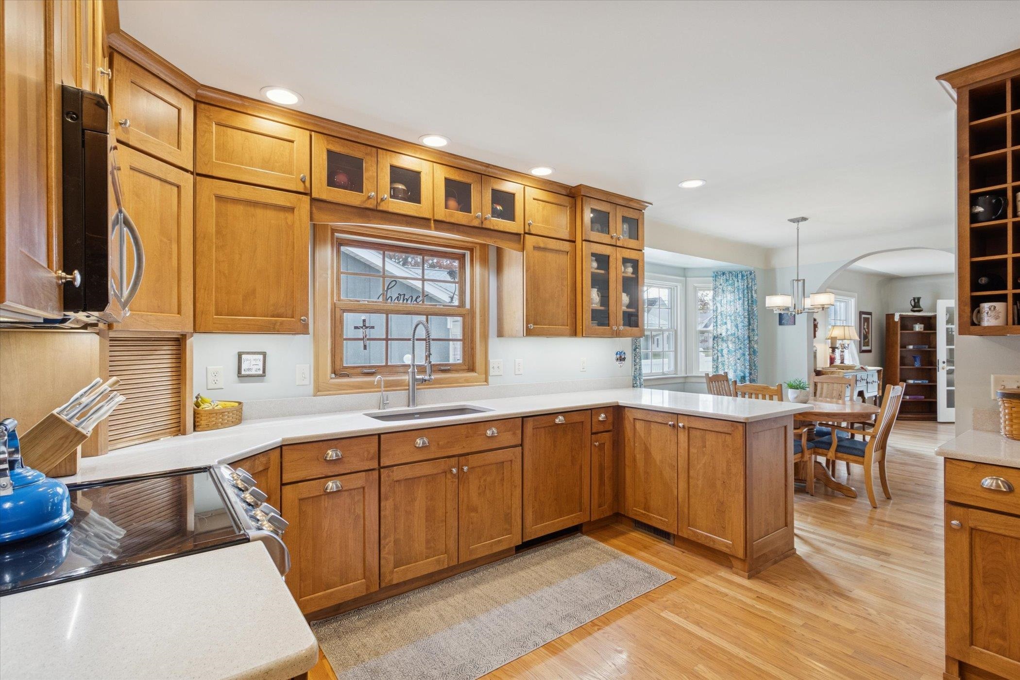 1408 Ave D Sterling, IL 61081 - Photo 26 of 55 a large kitchen with stainless steel appliances granite countertop a sink and cabinets