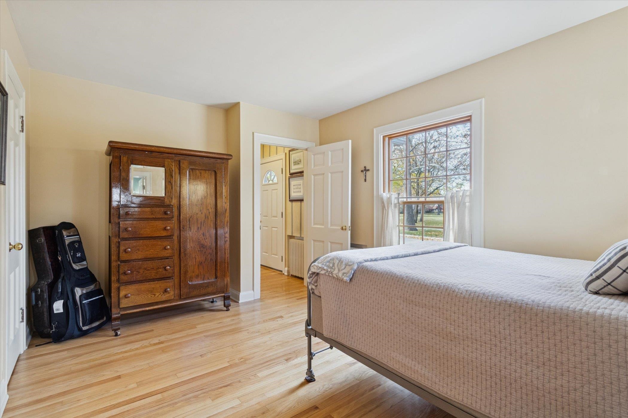 1408 Ave D Sterling, IL 61081 - Photo 31 of 55 a bedroom with a bed and wooden floor