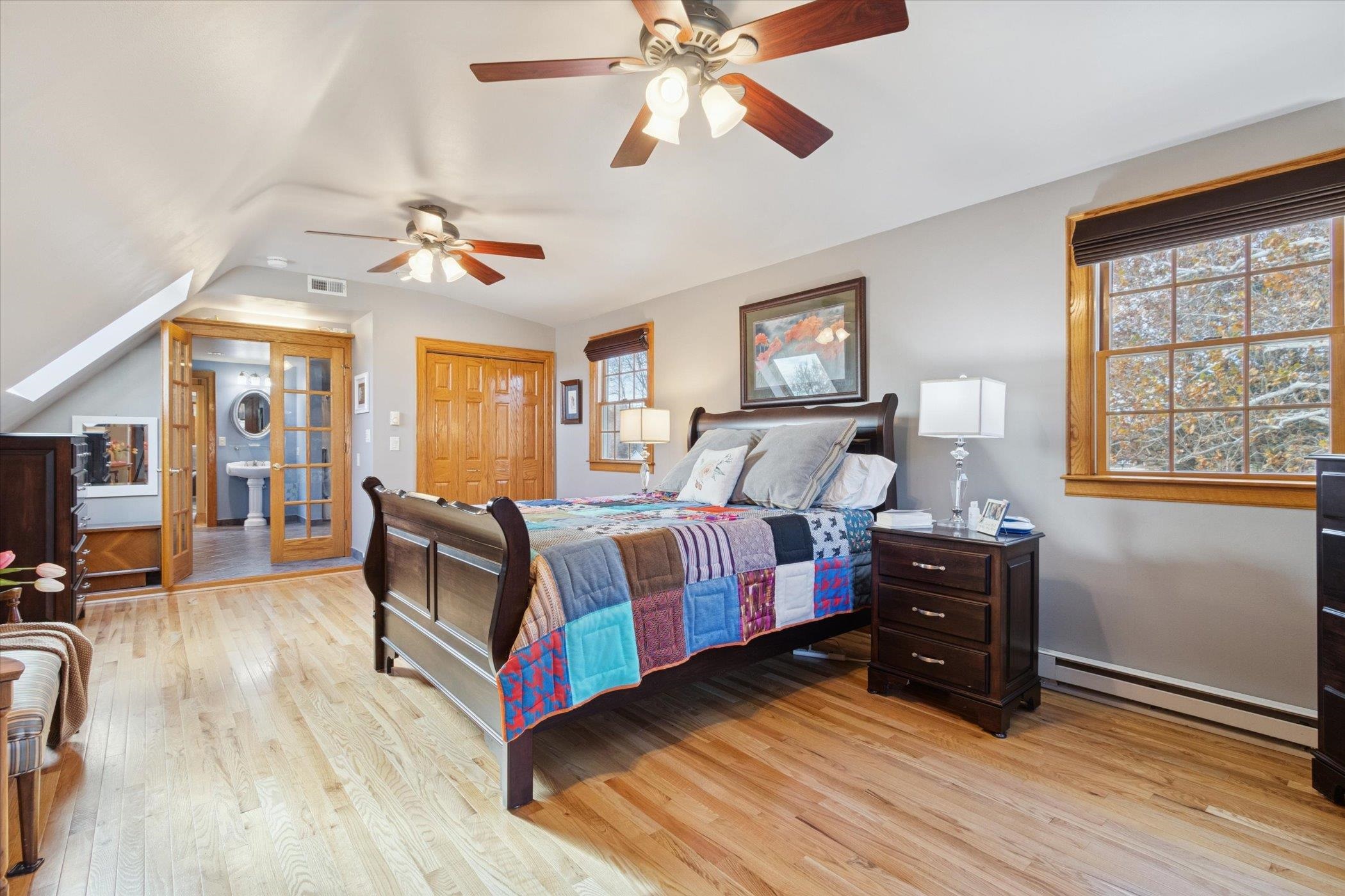 1408 Ave D Sterling, IL 61081 - Photo 34 of 55 a bedroom with a bed dresser and wooden floor