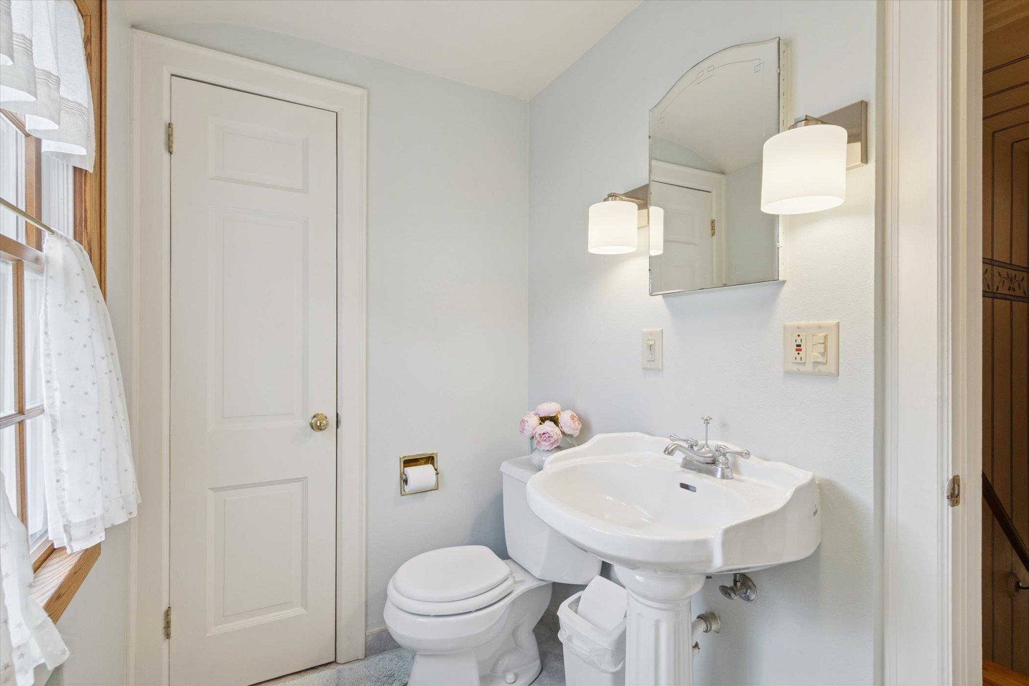 1408 Ave D Sterling, IL 61081 - Photo 40 of 55 a bathroom with a sink a toilet and shower