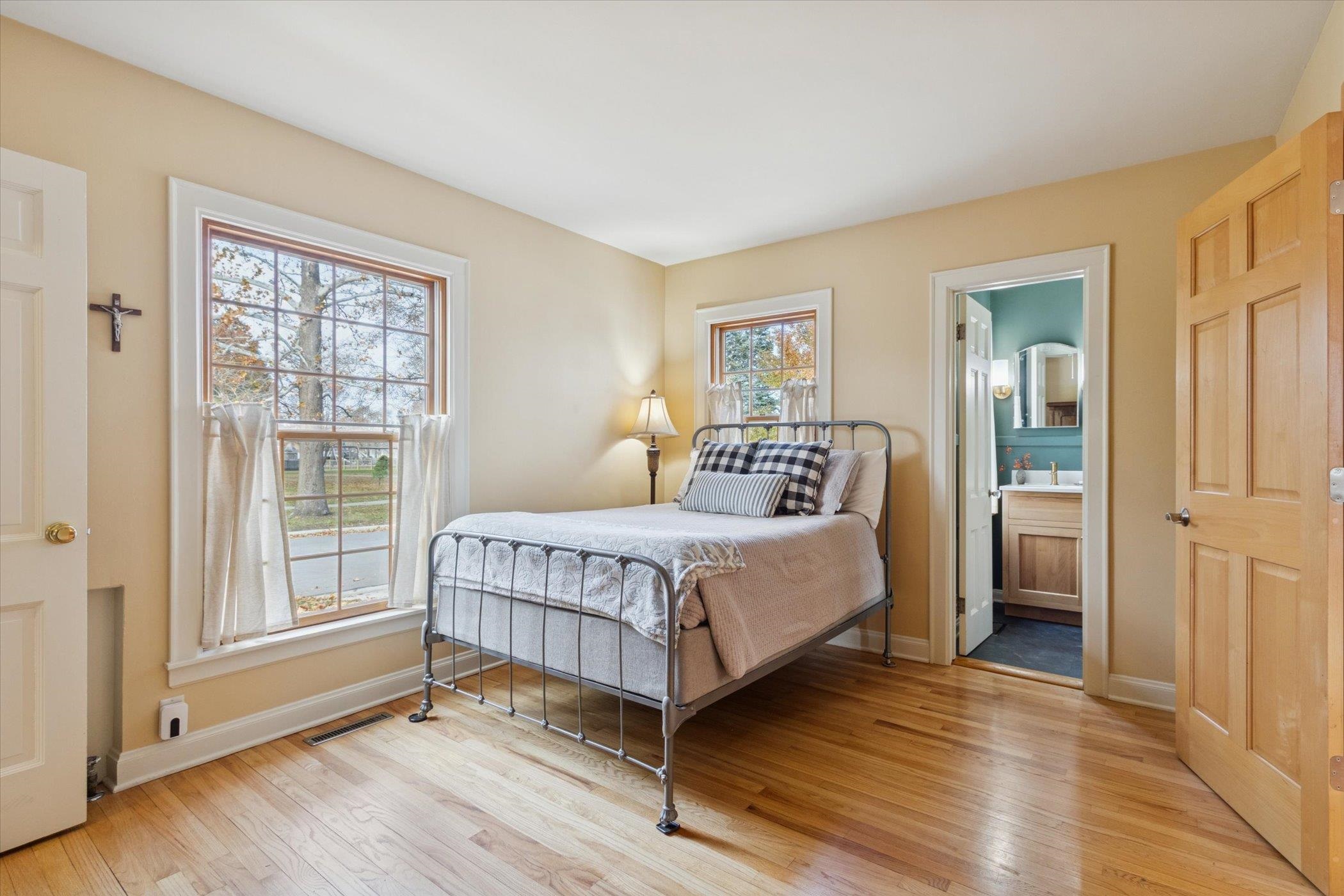 1408 Ave D Sterling, IL 61081 - Photo 45 of 56 a bedroom with a bed and wooden floor
