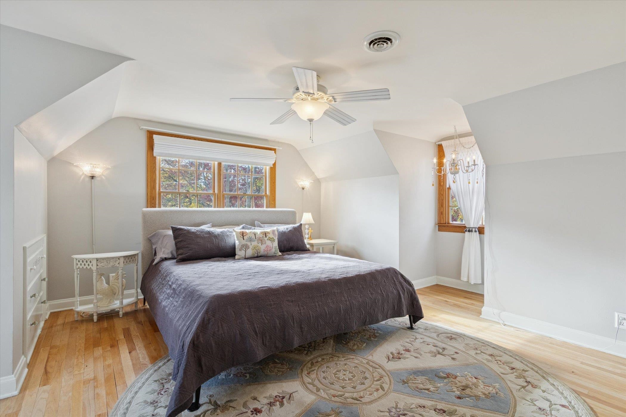 1408 Ave D Sterling, IL 61081 - Photo 51 of 56 a bedroom with a bed and a chandelier