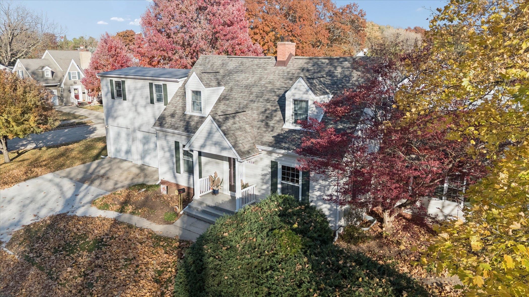 1408 Ave D Sterling, IL 61081 - Photo 8 of 55 a aerial view of a house with a yard and large trees