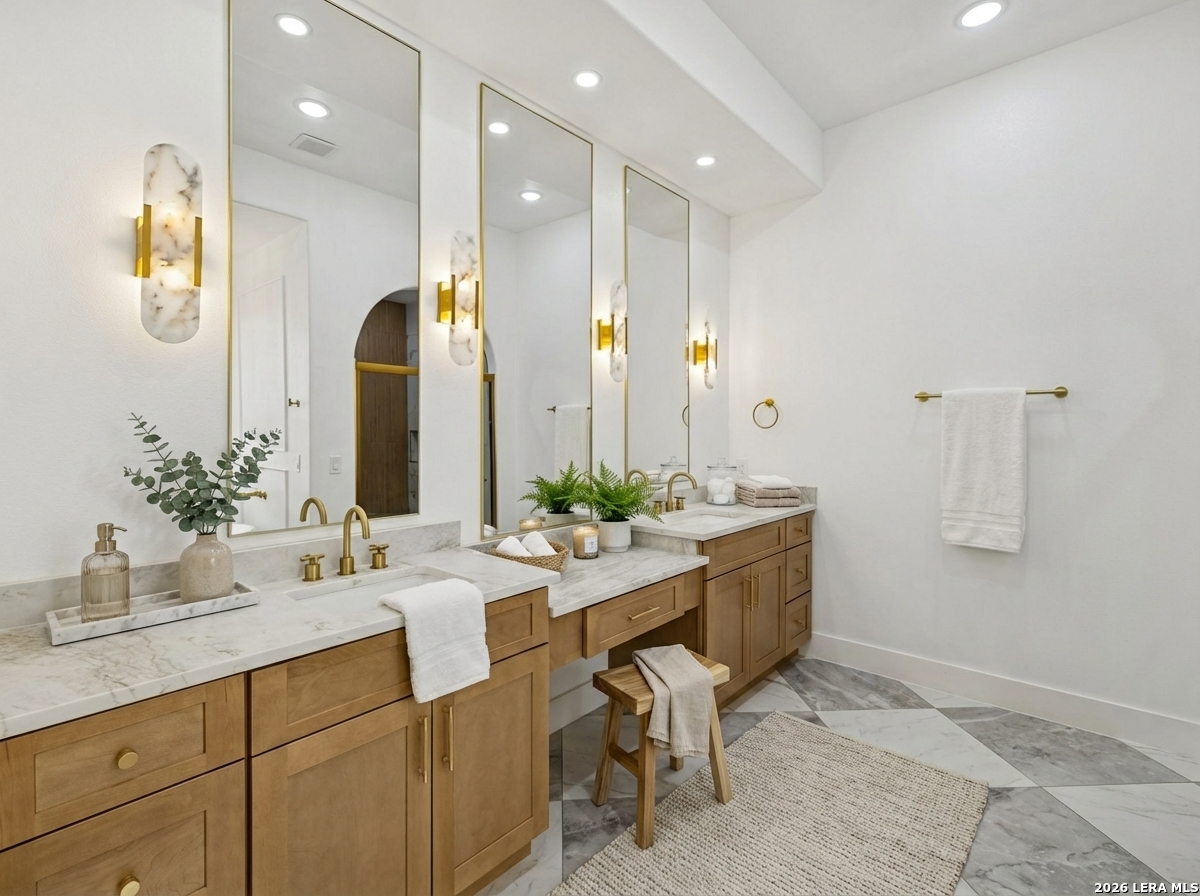 191 Hidden Ranch Court Floresville, TX 78114 - Photo 19 of 38 a bathroom with a sink and a mirror