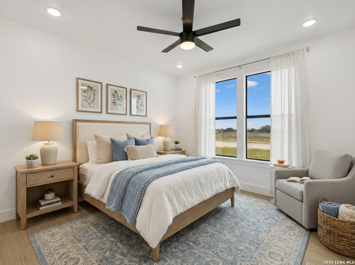 191 Hidden Ranch Court Floresville, TX 78114 - Photo 23 of 38 a bedroom with a bed and a couch