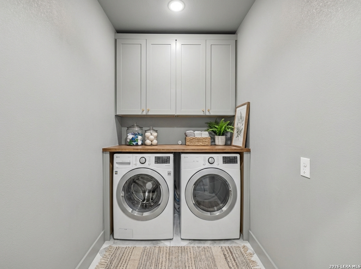 191 Hidden Ranch Court Floresville, TX 78114 - Photo 30 of 38 a utility room with dryer and washer