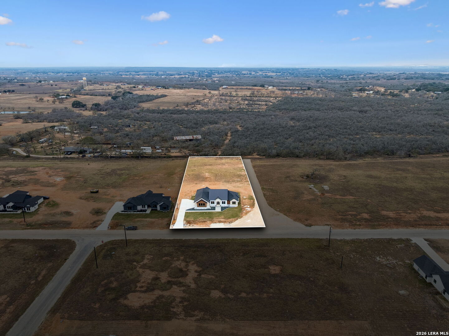 191 Hidden Ranch Court Floresville, TX 78114 - Photo 37 of 38 an aerial view of a residential houses with outdoor space