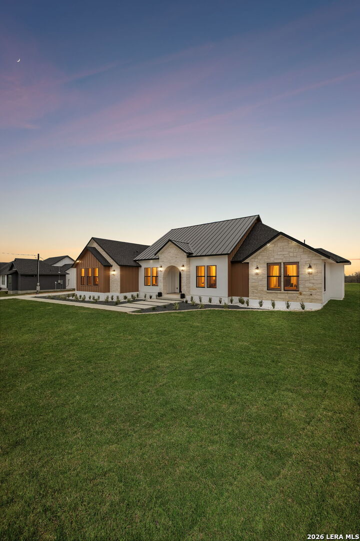 191 Hidden Ranch Court Floresville, TX 78114 - Photo 38 of 38 a front view of a house with garden