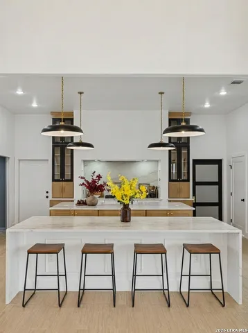 a kitchen with a table and chairs