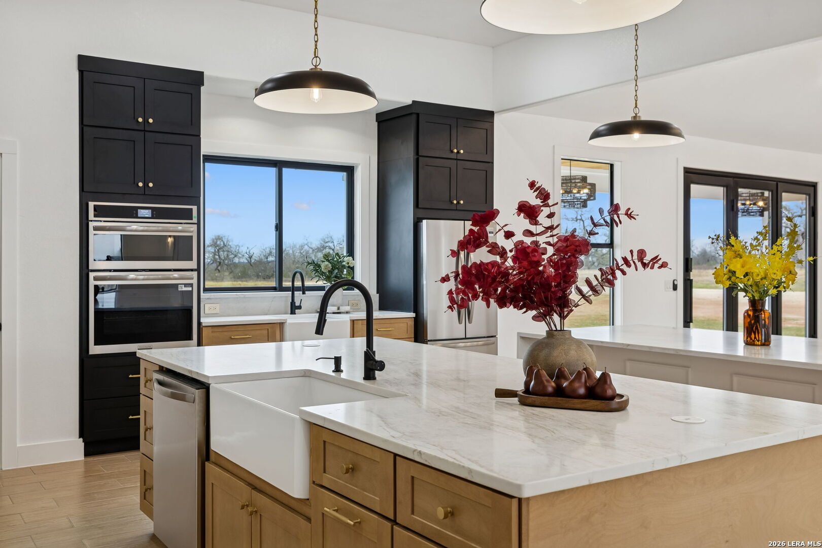 191 Hidden Ranch Court Floresville, TX 78114 - Photo 9 of 38 a kitchen with stainless steel appliances granite countertop a sink dishwasher and a refrigerator