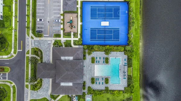 an aerial view of a house with a lake view