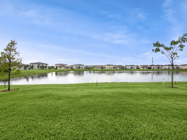 a view of a lake with houses in the back