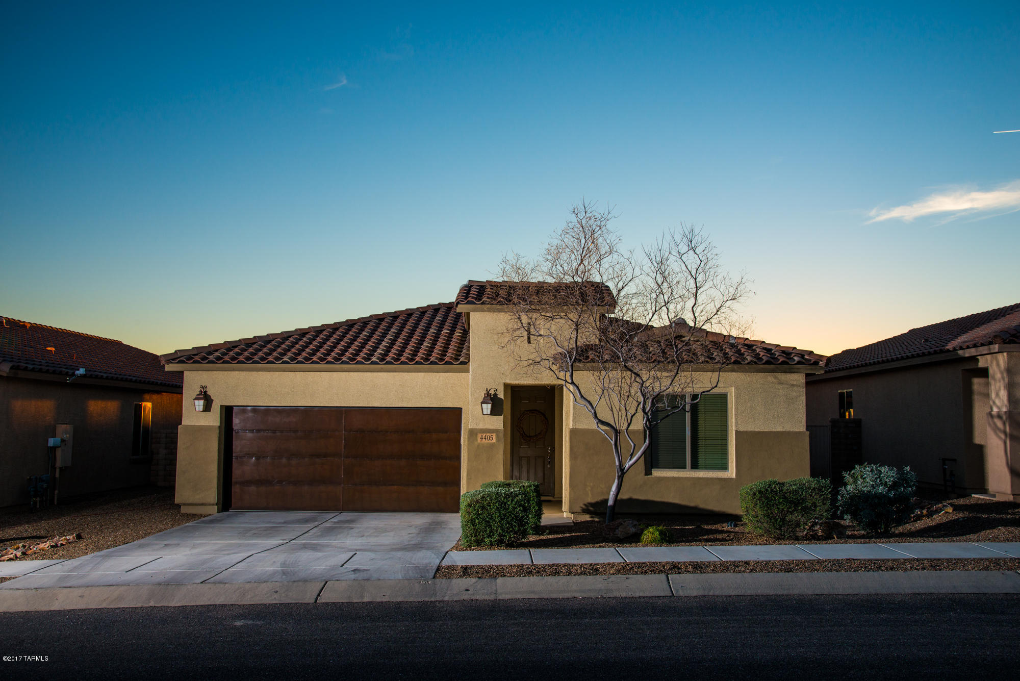 4405 West Crystal Ranch Place Marana, AZ 85658 - Photo 36 of 44 a front view of a house with a yard