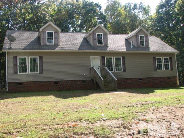 7821 McKee Road Rougemont, NC 27572 - Photo 1 of 25 a front view of a house with a yard