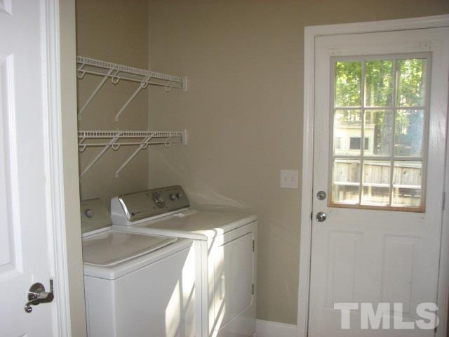 7821 McKee Road Rougemont, NC 27572 - Photo 14 of 25 a utility room with a window dryer and washer