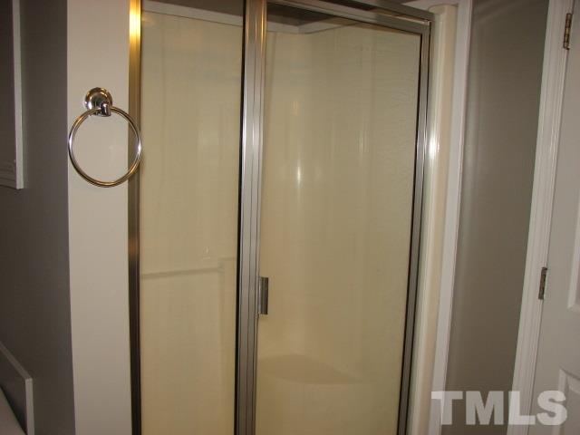 7821 McKee Road Rougemont, NC 27572 - Photo 22 of 25 a bathroom with a shower and mirror