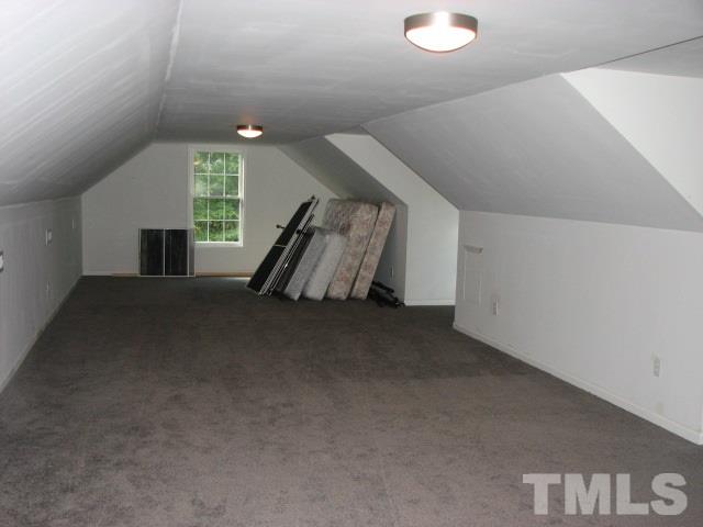 7821 McKee Road Rougemont, NC 27572 - Photo 23 of 25 a view of a livingroom with furniture and stairs
