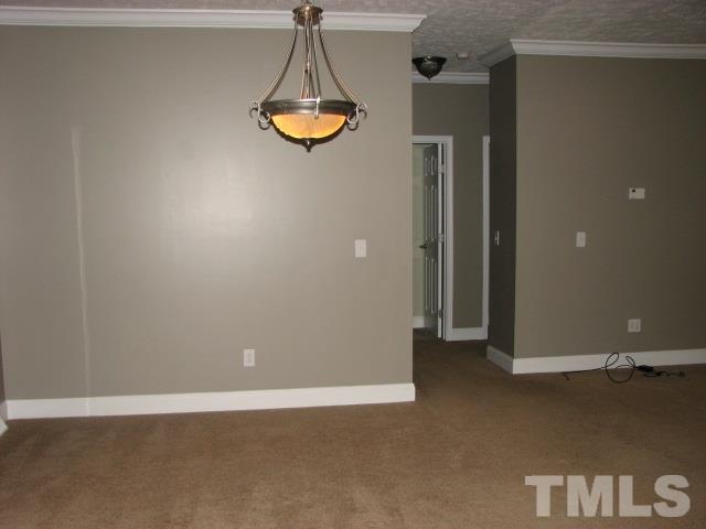 7821 McKee Road Rougemont, NC 27572 - Photo 8 of 25 a view of a livingroom with a chandelier