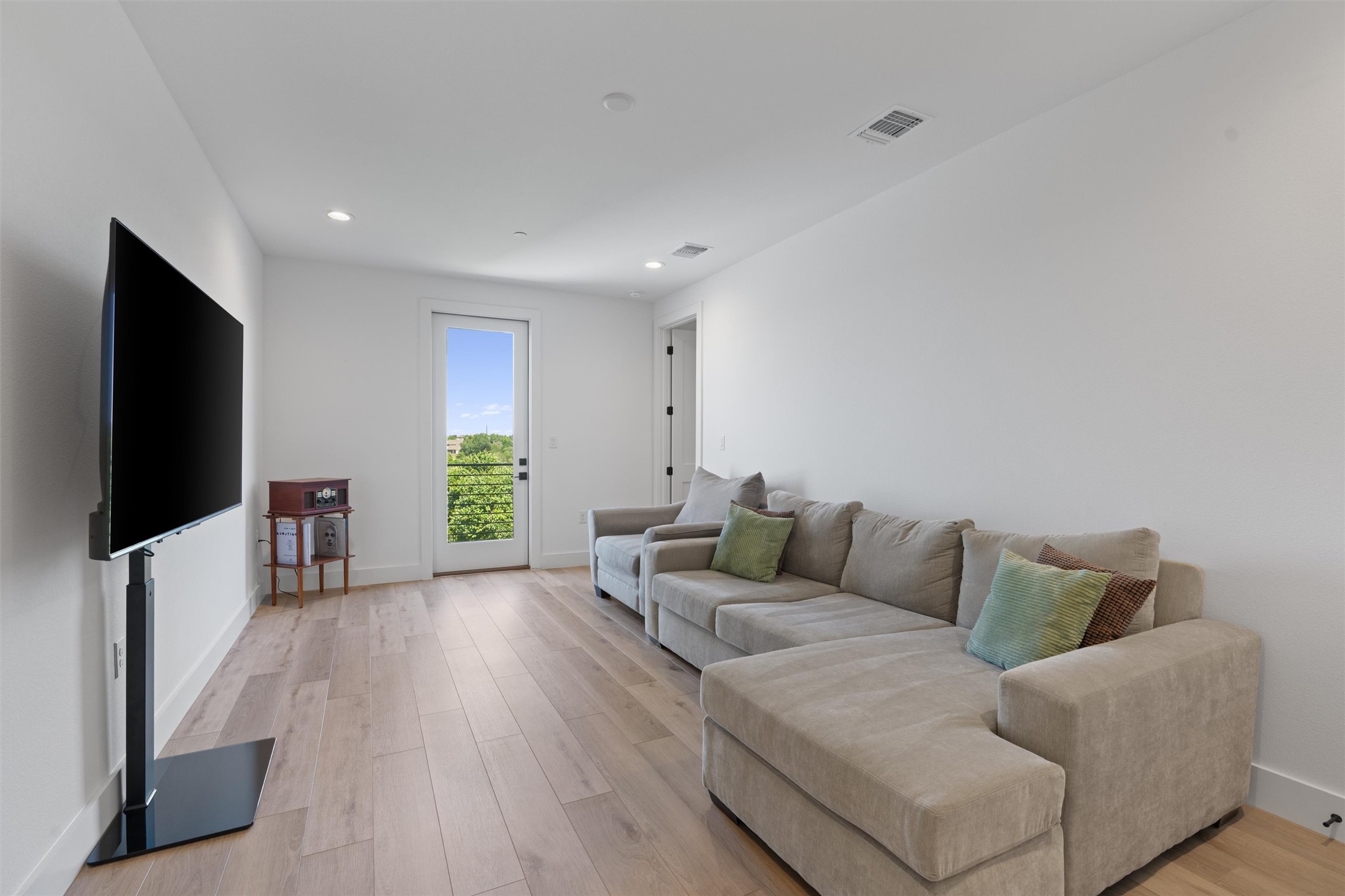 590 Old Mill Road, Unit 153 Cedar Park, TX 78613 - Photo 12 of 40 a living room with furniture and a flat screen tv