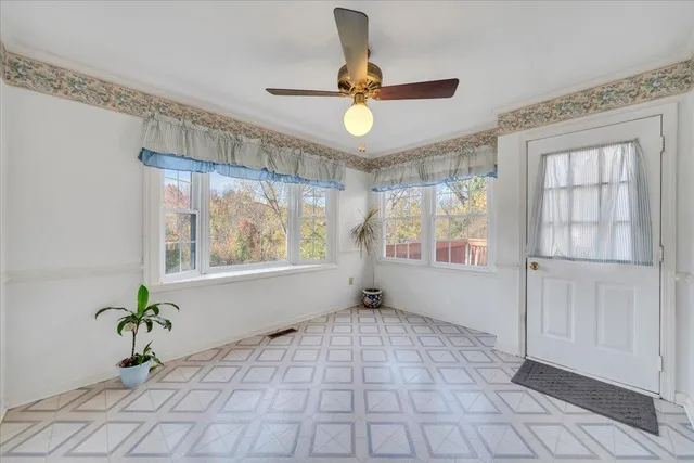 a view of an empty room and window