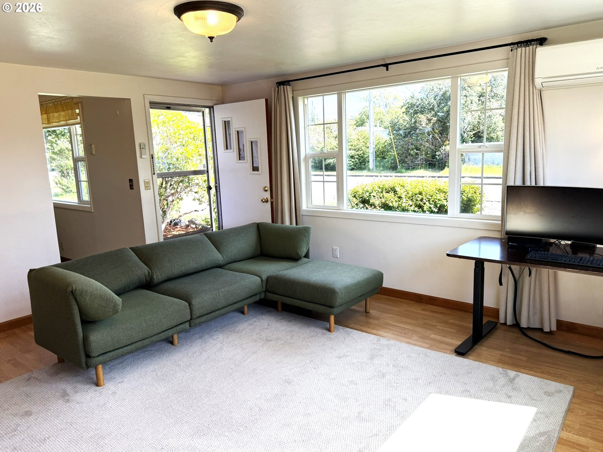 1179 6th Street Florence, OR 97439 - Photo 19 of 26 a living room with furniture and a window