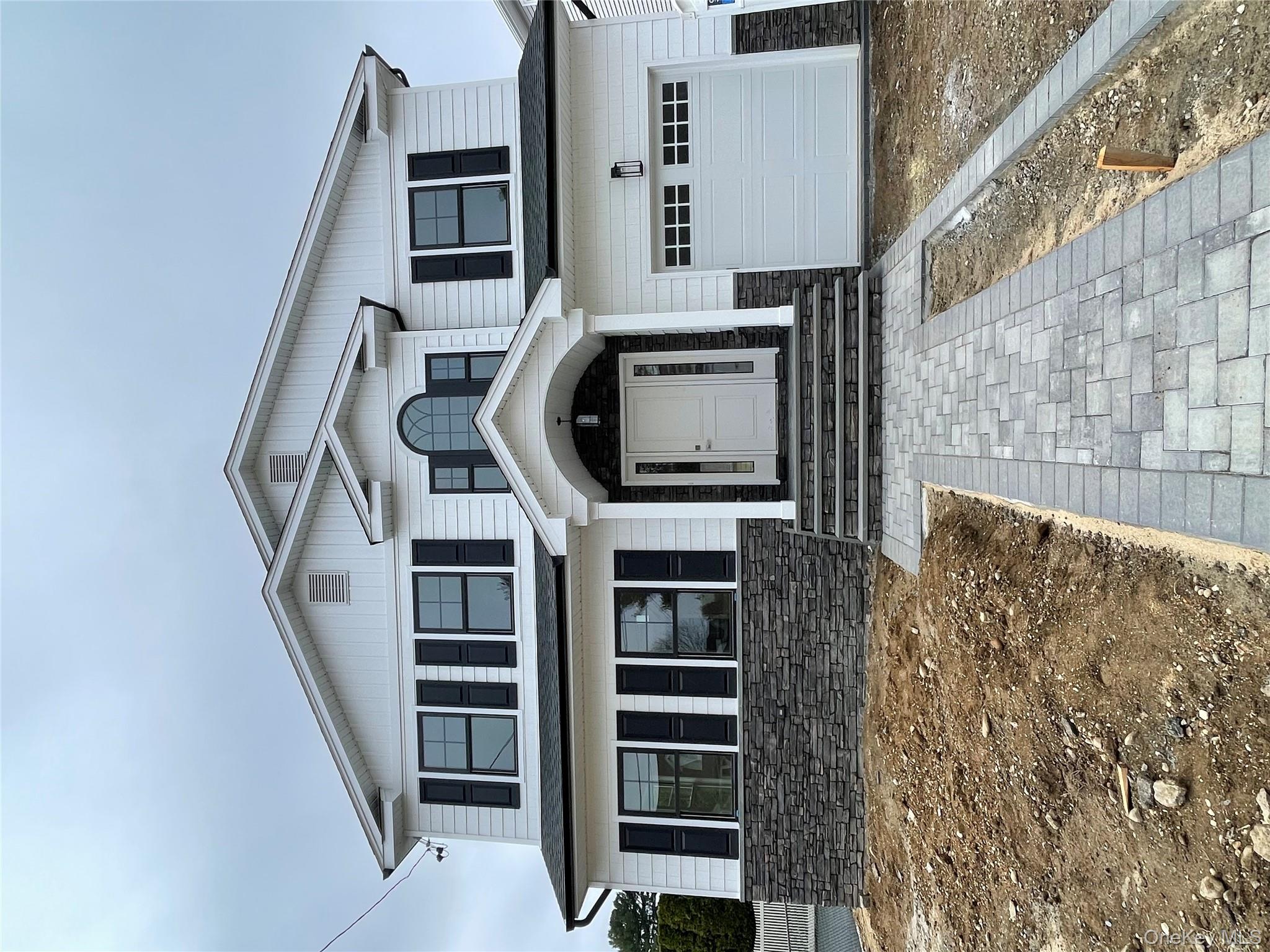 477 Andrews Road, Unit LOT A Mineola, NY 11501 - Photo 21 of 21 a front view of a house