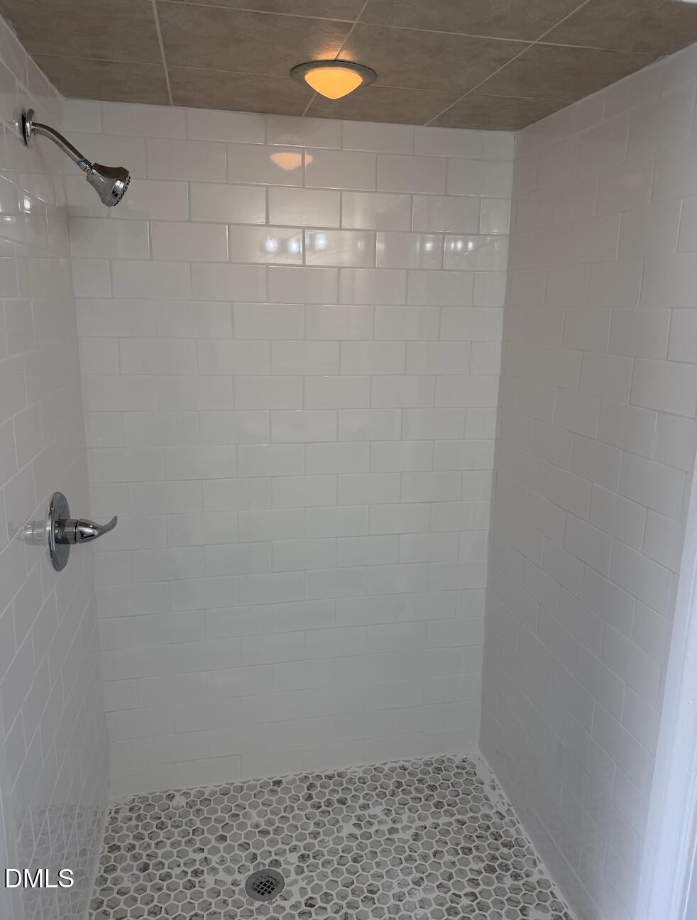 702 West Main Street Benson, NC 27504 - Photo 12 of 16 a bathroom with a shower