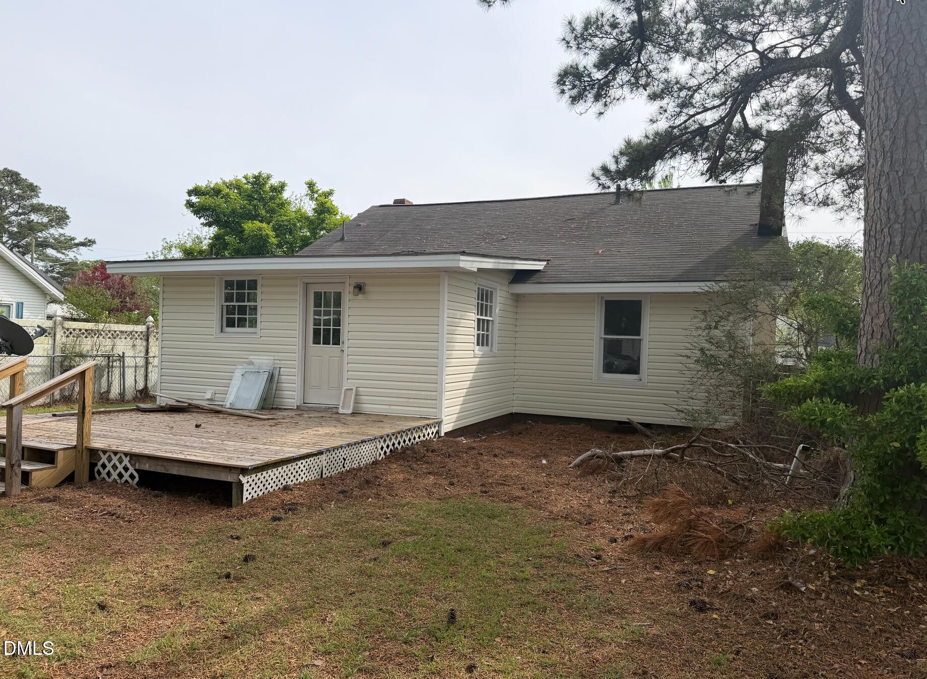 702 West Main Street Benson, NC 27504 - Photo 2 of 16 a view of a house with a backyard