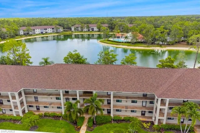 an aerial view of a house with a lake view