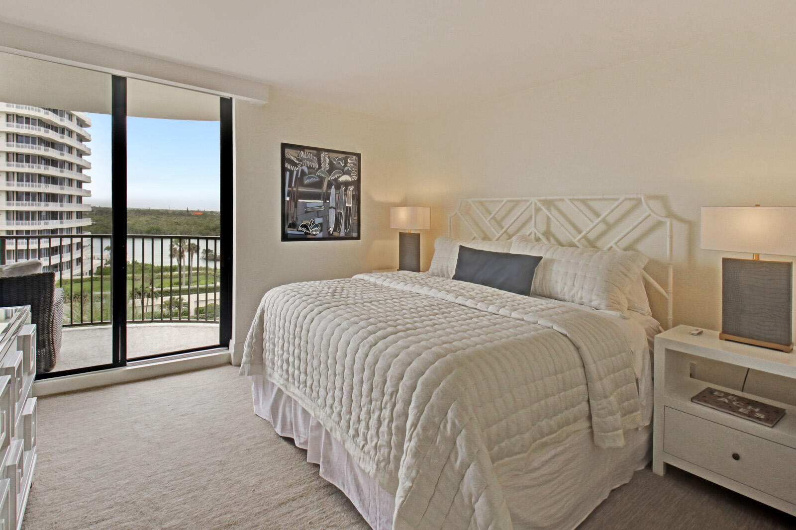 400 South Beach Road, Unit 504 Tequesta, FL 33469 - Photo 13 of 22 a bedroom with a bed and a tv
