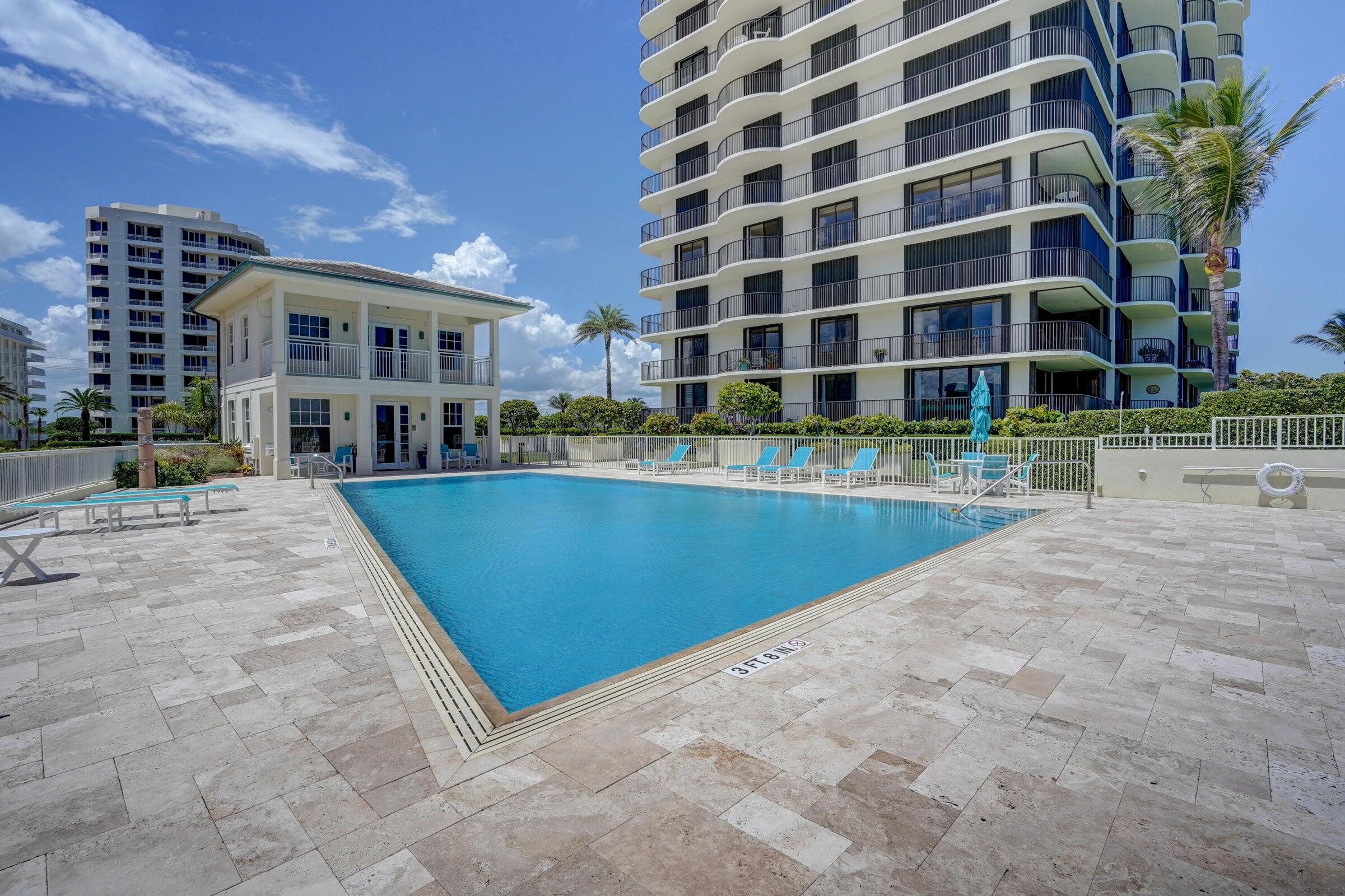 400 South Beach Road, Unit 504 Tequesta, FL 33469 - Photo 17 of 22 a view of a building with a swimming pool